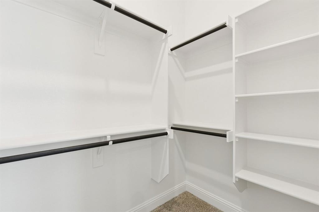 1366 Chisos Way Forney, TX 75126 - Photo 21 of 38 a view of an empty walk in closet