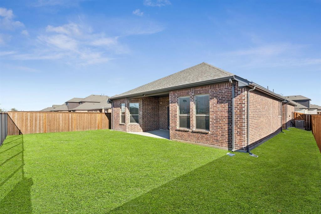 1366 Chisos Way Forney, TX 75126 - Photo 28 of 38 a view of a house with backyard and garden