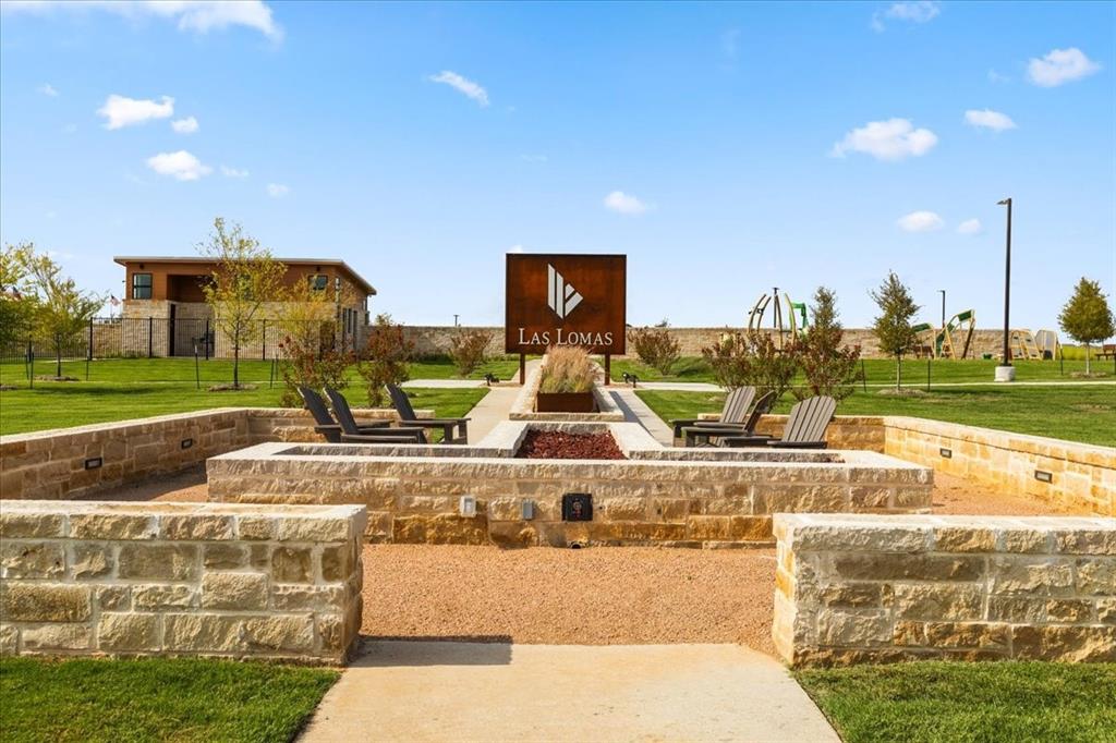 1366 Chisos Way Forney, TX 75126 - Photo 31 of 38 a view of a swimming pool with a lawn chairs and a yard