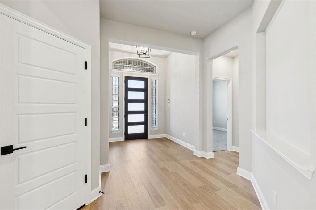 1366 Chisos Way Forney, TX 75126 - Photo 4 of 38 wooden floor in an empty room