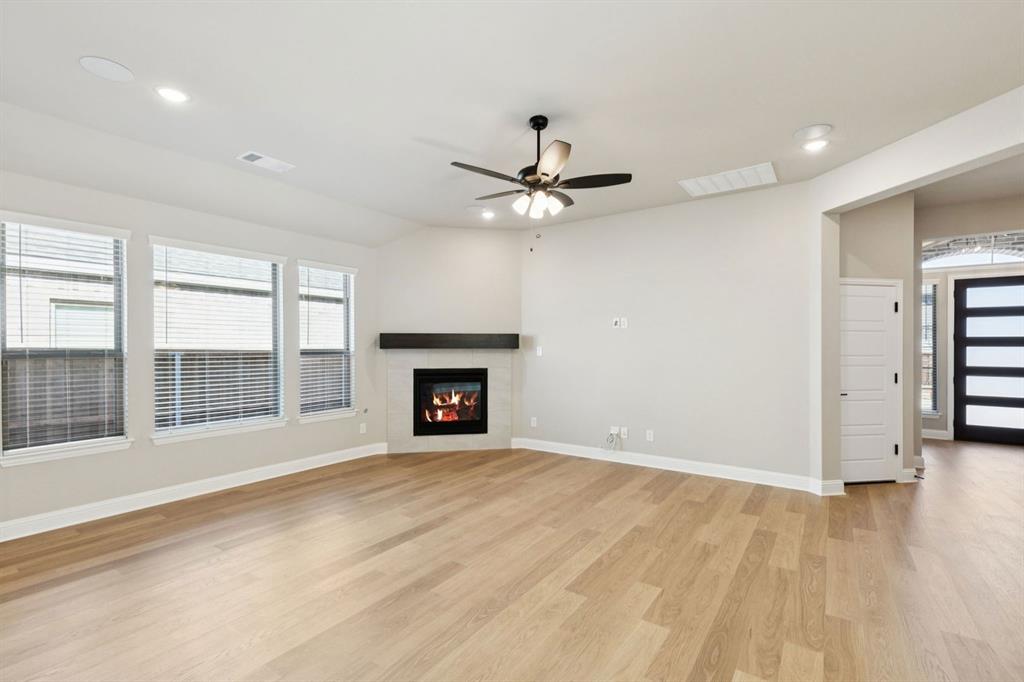1366 Chisos Way Forney, TX 75126 - Photo 7 of 38 an empty room with fan and windows