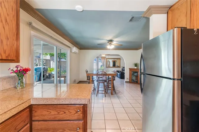 a kitchen with stainless steel appliances granite countertop a refrigerator and a stove
