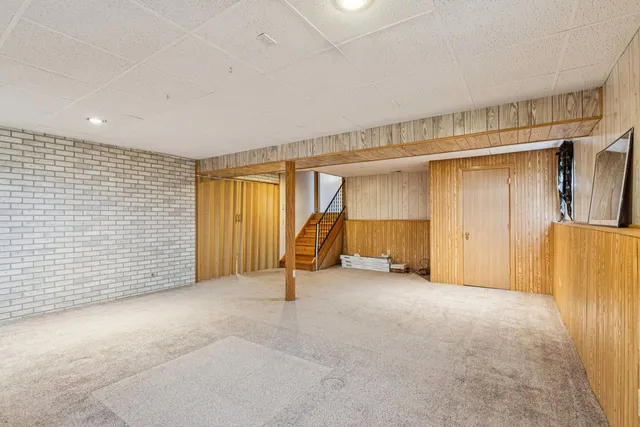 a view of a room with gym equipment and a large window