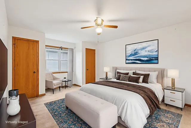 a bedroom with double bed and a window