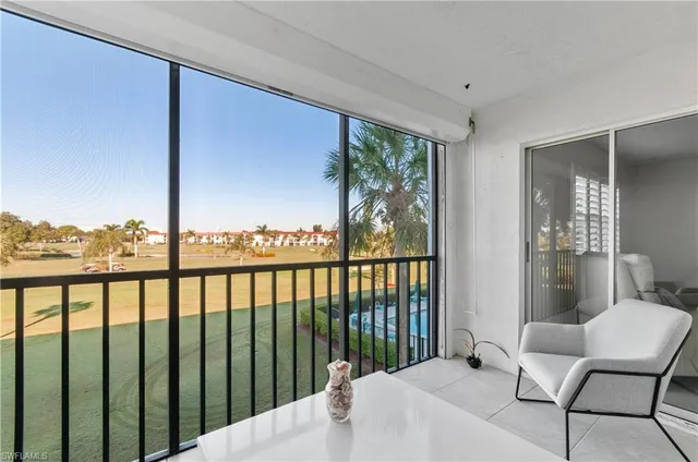 a view of a balcony with furniture