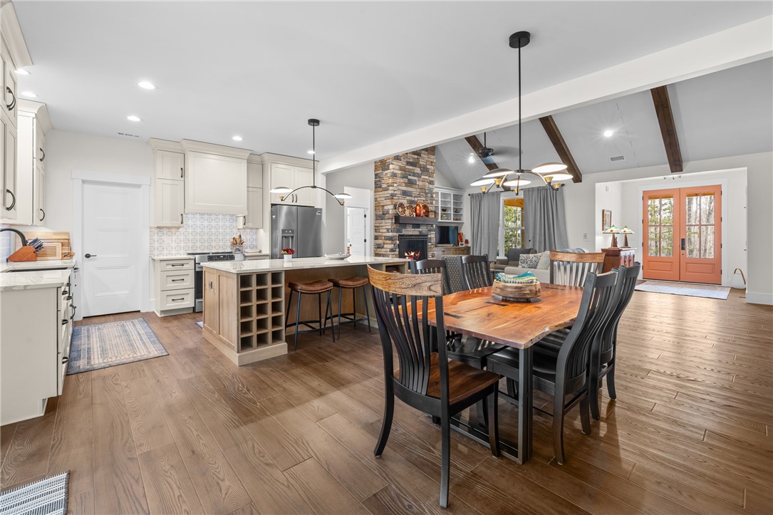 113 South Oak Pointe Drive Seneca, SC 29672 - Photo 11 of 50 This open concept living space features a gourmet kitchen, an inviting dining area, and a cozy family room.