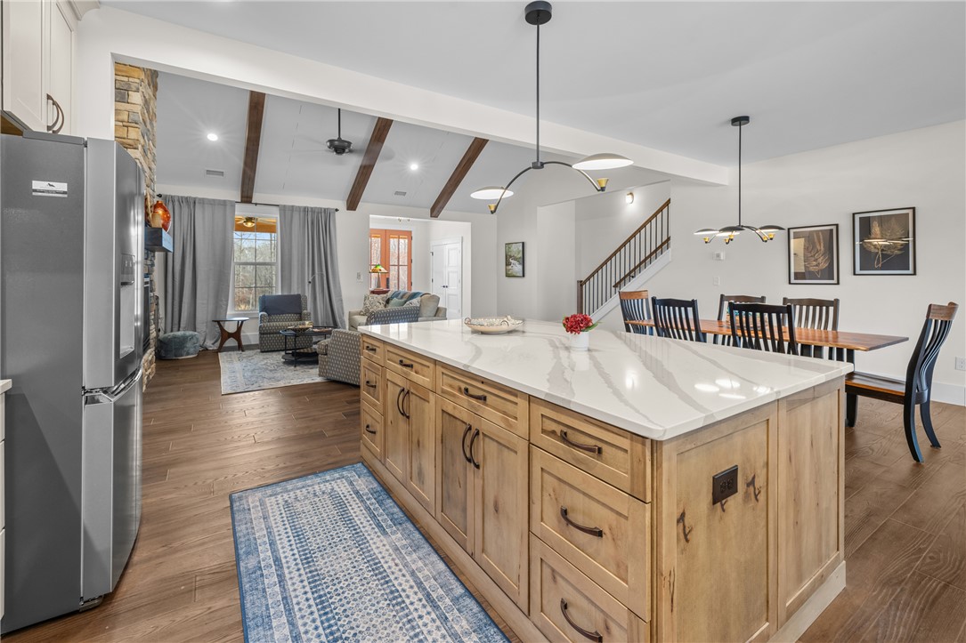 113 South Oak Pointe Drive Seneca, SC 29672 - Photo 15 of 50 An inviting open-concept living area features vaulted ceilings and rich wood flooring.