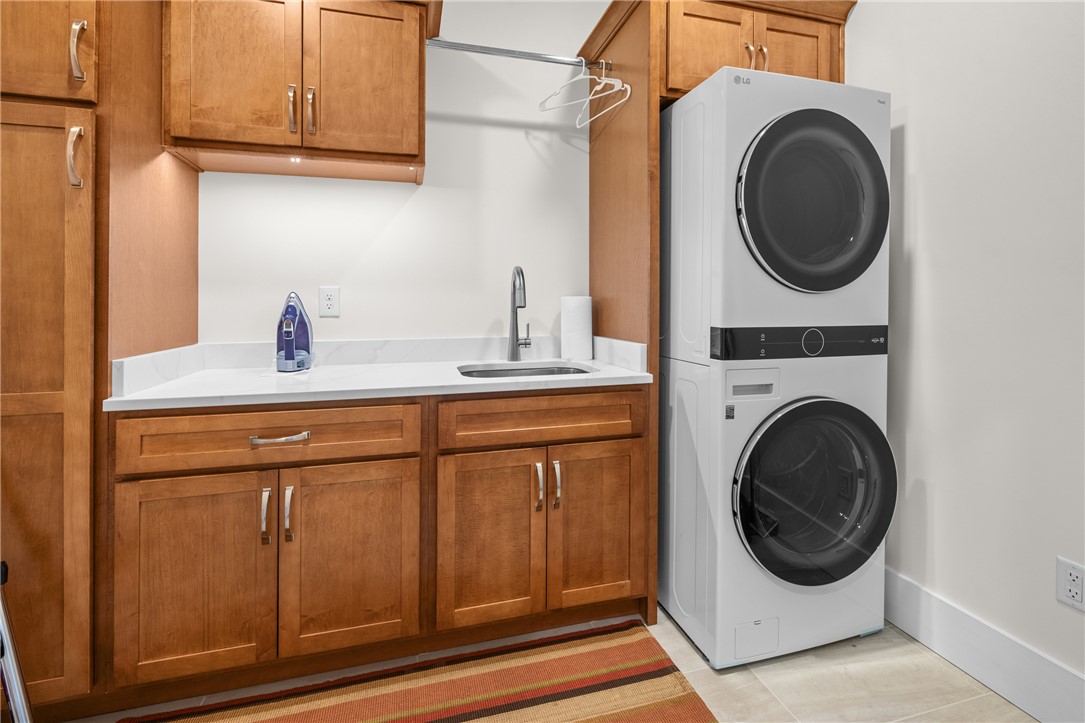 113 South Oak Pointe Drive Seneca, SC 29672 - Photo 19 of 50 This thoughtfully designed laundry room provides both convenience and elegant storage solutions.