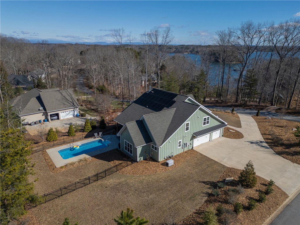 113 South Oak Pointe Drive Seneca, SC 29672 - Photo 2 of 50 This captivating residence boasts a private pool and a picturesque lakefront setting.