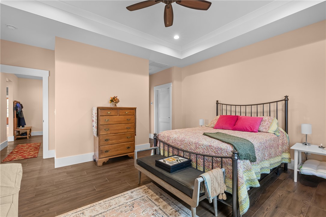 113 South Oak Pointe Drive Seneca, SC 29672 - Photo 21 of 50 This spacious bedroom offers a tranquil retreat with elegant design elements and rich wood flooring.