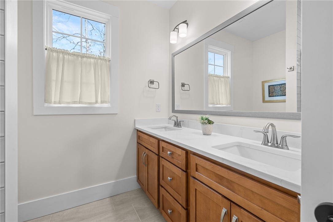 113 South Oak Pointe Drive Seneca, SC 29672 - Photo 26 of 50 This bright bathroom features a spacious double vanity and ample natural light.