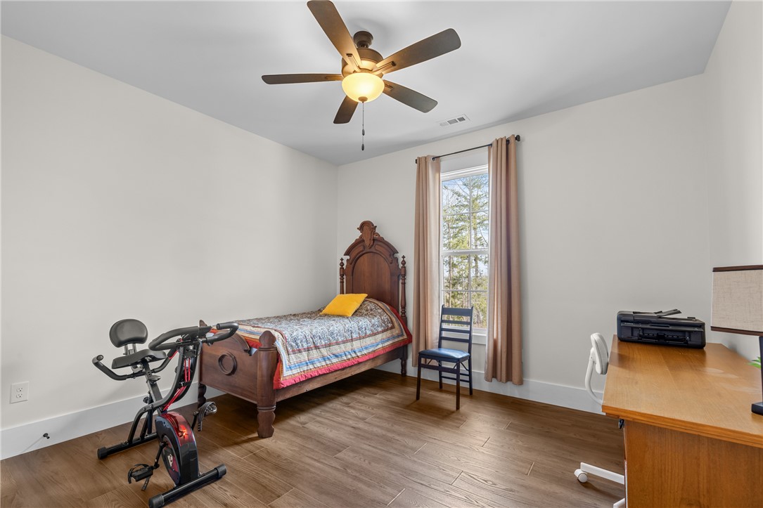 113 South Oak Pointe Drive Seneca, SC 29672 - Photo 27 of 50 This bright room features a large window, elegant flooring, and ample space for various activities.