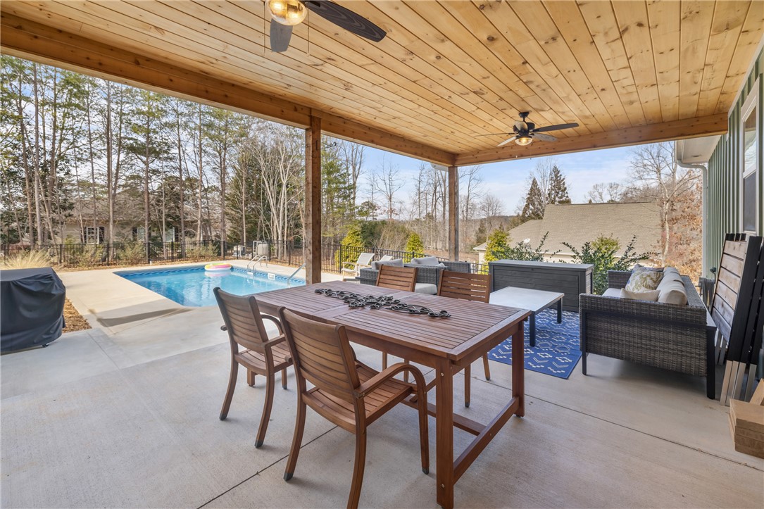113 South Oak Pointe Drive Seneca, SC 29672 - Photo 33 of 50 Enjoy outdoor living with a spacious patio, inviting pool, and tranquil views.