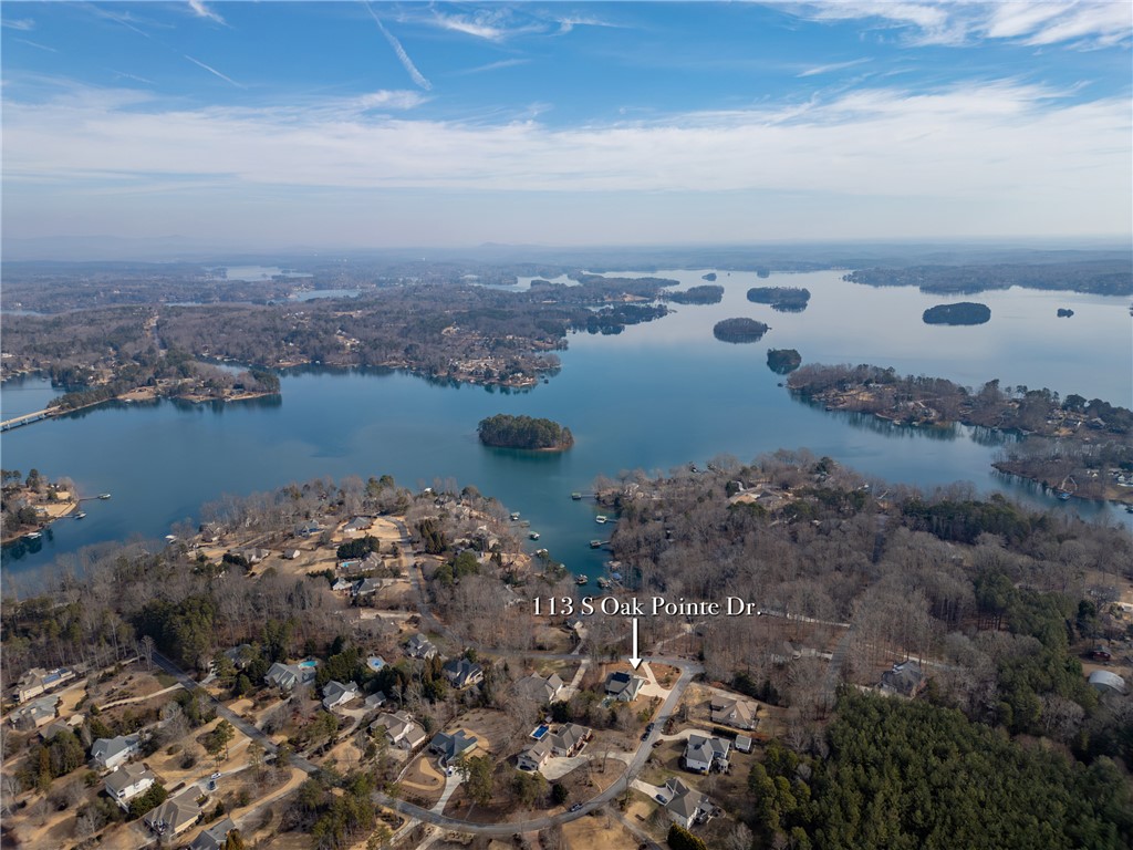 113 South Oak Pointe Drive Seneca, SC 29672 - Photo 38 of 50 This panoramic aerial captures an expansive waterfront community nestled among serene natural landscapes.