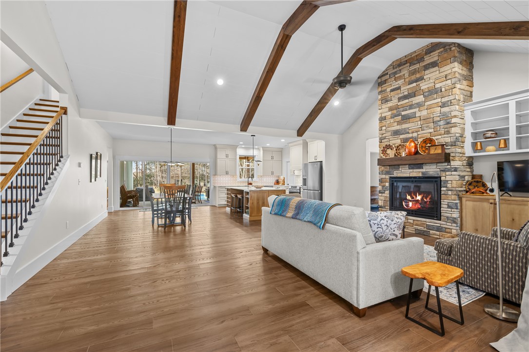 113 South Oak Pointe Drive Seneca, SC 29672 - Photo 6 of 50 This inviting living space features an open concept layout with vaulted ceilings and a cozy fireplace.