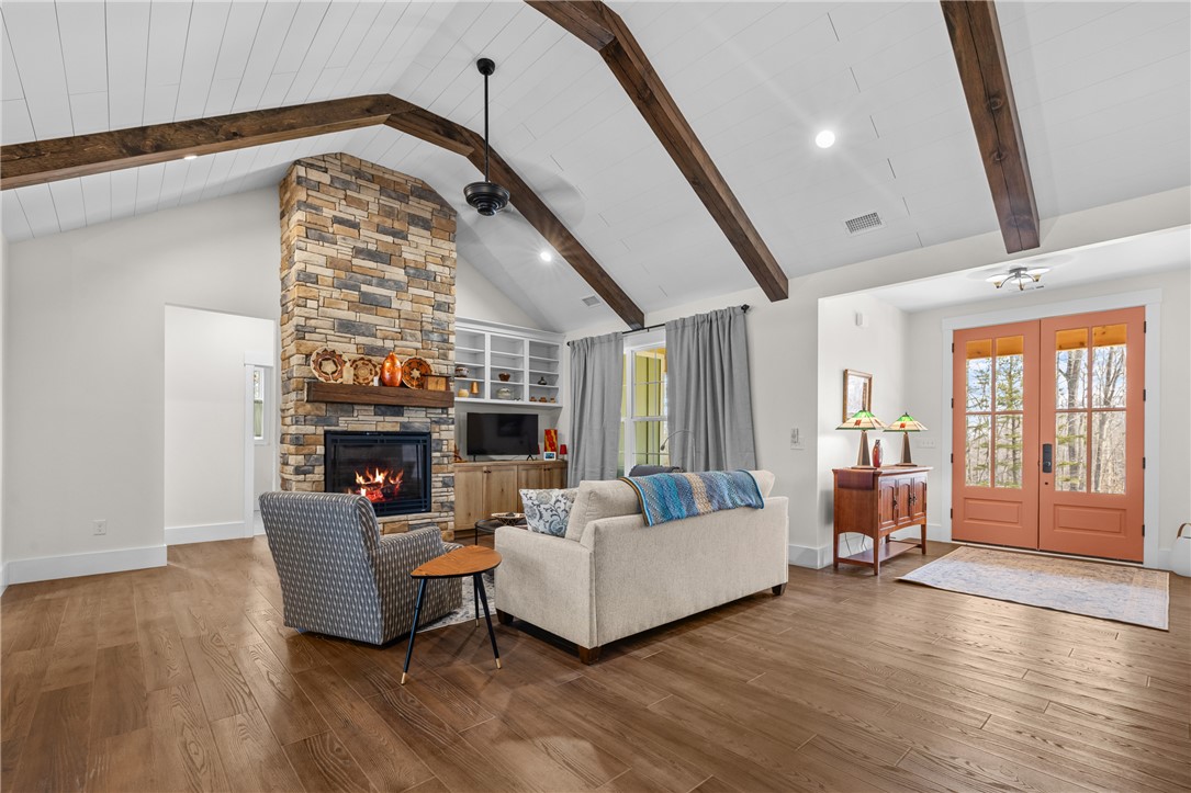113 South Oak Pointe Drive Seneca, SC 29672 - Photo 7 of 50 This living room features high ceilings and a cozy fireplace, perfect for gatherings.