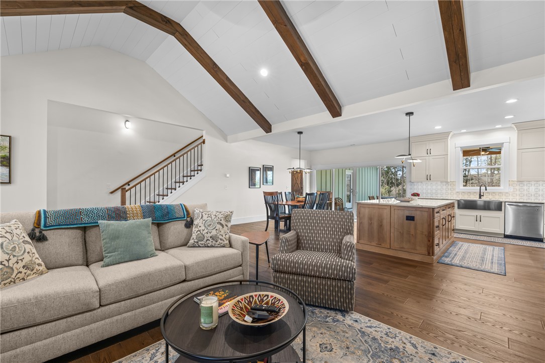 113 South Oak Pointe Drive Seneca, SC 29672 - Photo 9 of 50 Bright and open, this great room blends living, dining, and kitchen areas seamlessly.