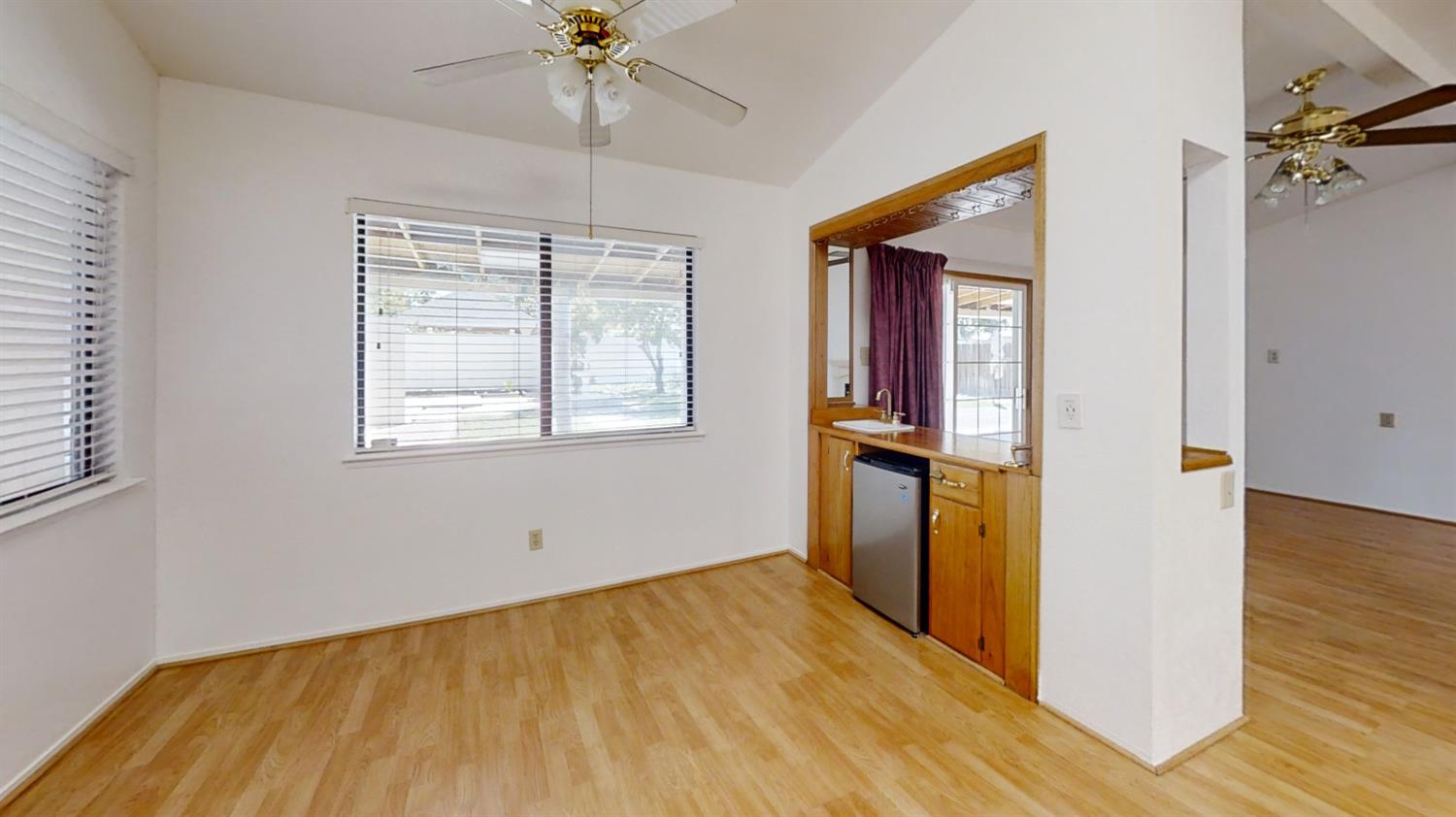 1712 Poppy Meadow Court Coalinga, CA 93210 - Photo 11 of 30 a view of empty room with wooden floor and fan
