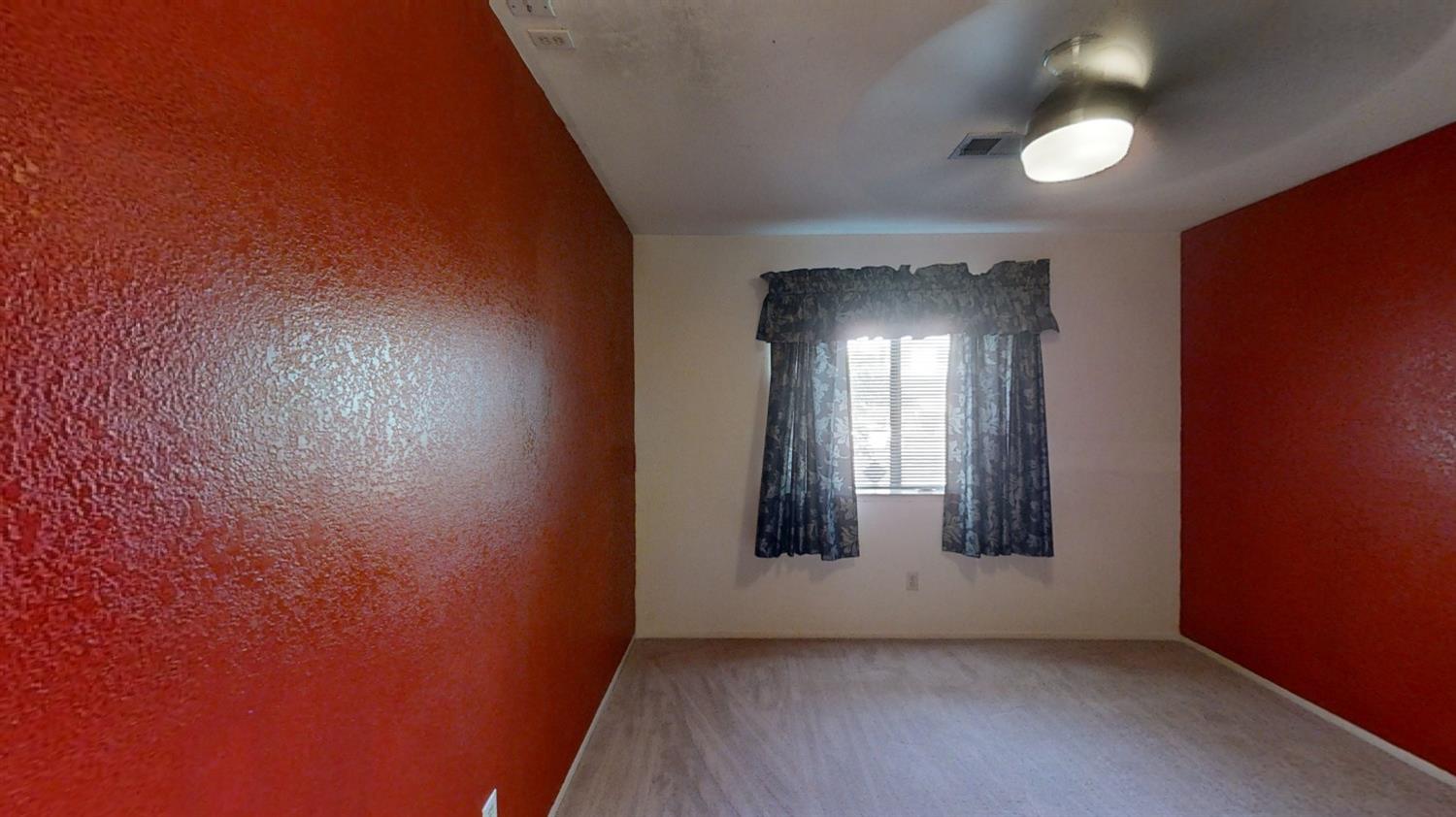 1712 Poppy Meadow Court Coalinga, CA 93210 - Photo 16 of 30 wooden floor in an empty room with a window