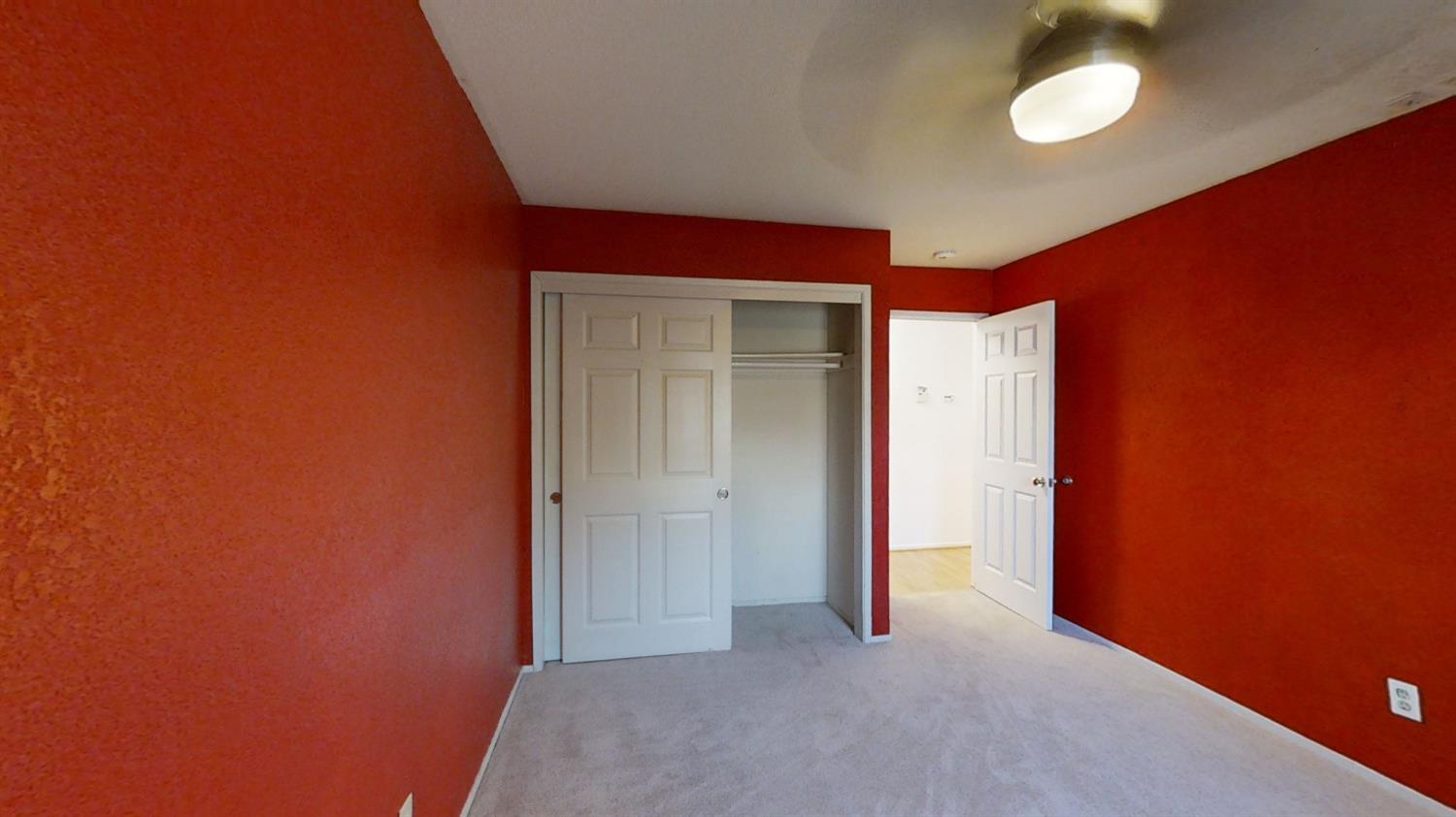 1712 Poppy Meadow Court Coalinga, CA 93210 - Photo 17 of 30 a view of a room with a ceiling fan and window