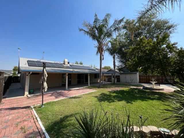 1712 Poppy Meadow Court Coalinga, CA 93210 - Photo 2 of 30 a view of a swimming pool with a patio and a yard