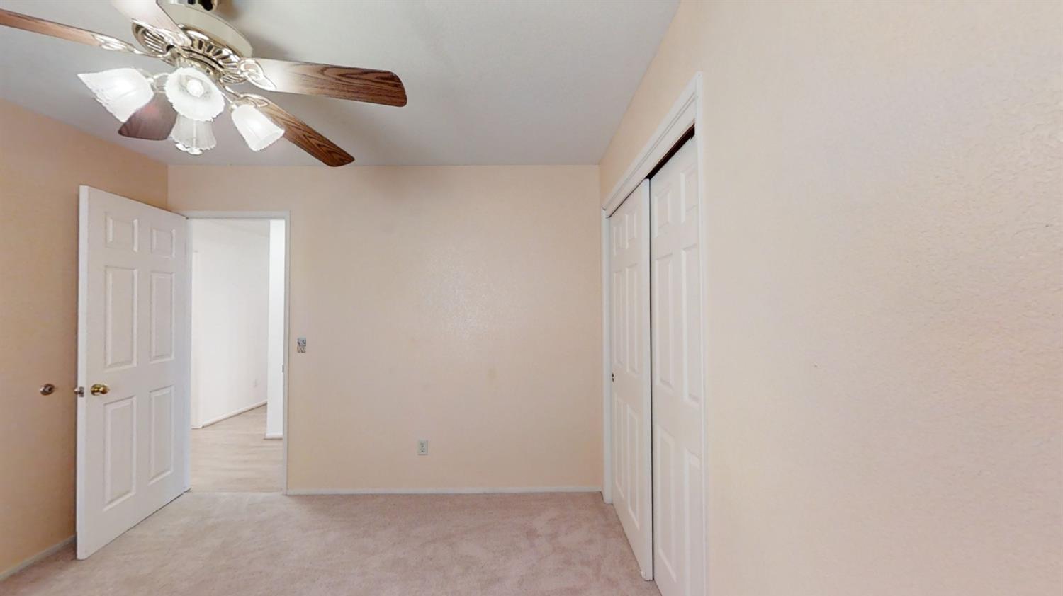 1712 Poppy Meadow Court Coalinga, CA 93210 - Photo 23 of 30 a view of a chandelier fan and closet in a room