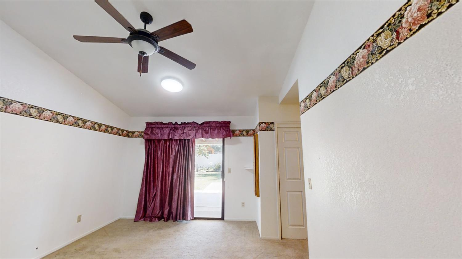 1712 Poppy Meadow Court Coalinga, CA 93210 - Photo 24 of 30 a view of a hallway with stairs and a ceiling fan