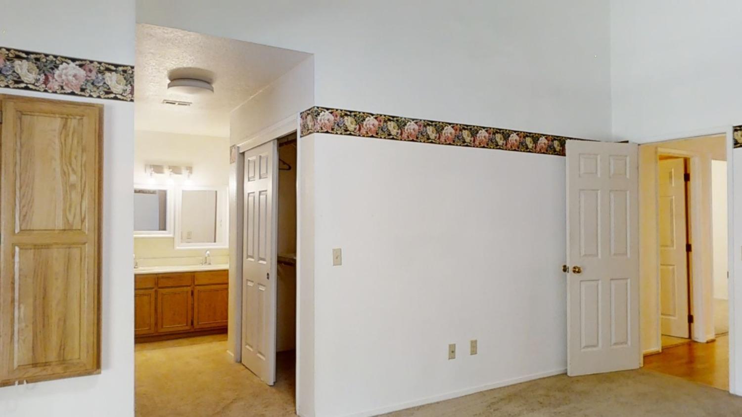 1712 Poppy Meadow Court Coalinga, CA 93210 - Photo 25 of 30 a view of a bathroom with a shower and a sink