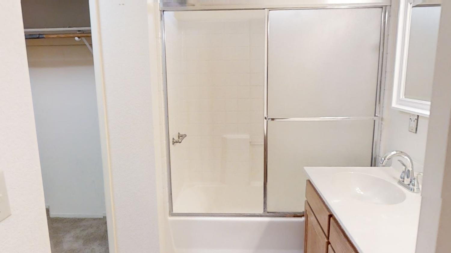 1712 Poppy Meadow Court Coalinga, CA 93210 - Photo 26 of 30 a bathroom with a sink a toilet and shower