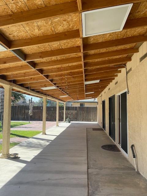 1712 Poppy Meadow Court Coalinga, CA 93210 - Photo 28 of 30 a view of a building with a backyard