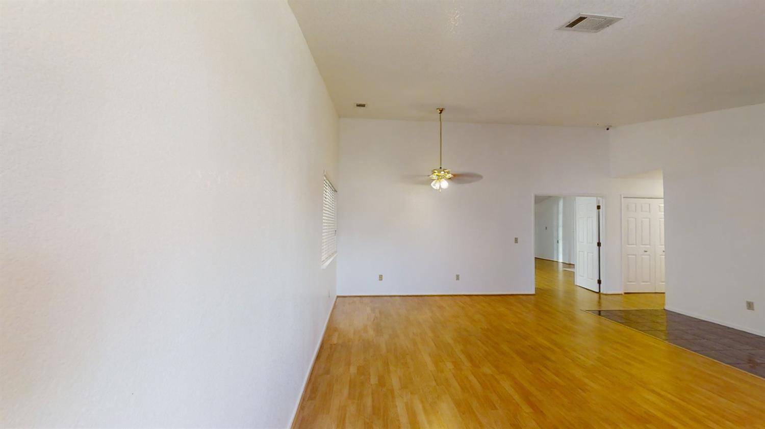 1712 Poppy Meadow Court Coalinga, CA 93210 - Photo 5 of 30 a view of empty room with wooden floor