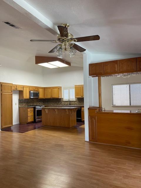 1712 Poppy Meadow Court Coalinga, CA 93210 - Photo 6 of 30 a living room with furniture and kitchen view