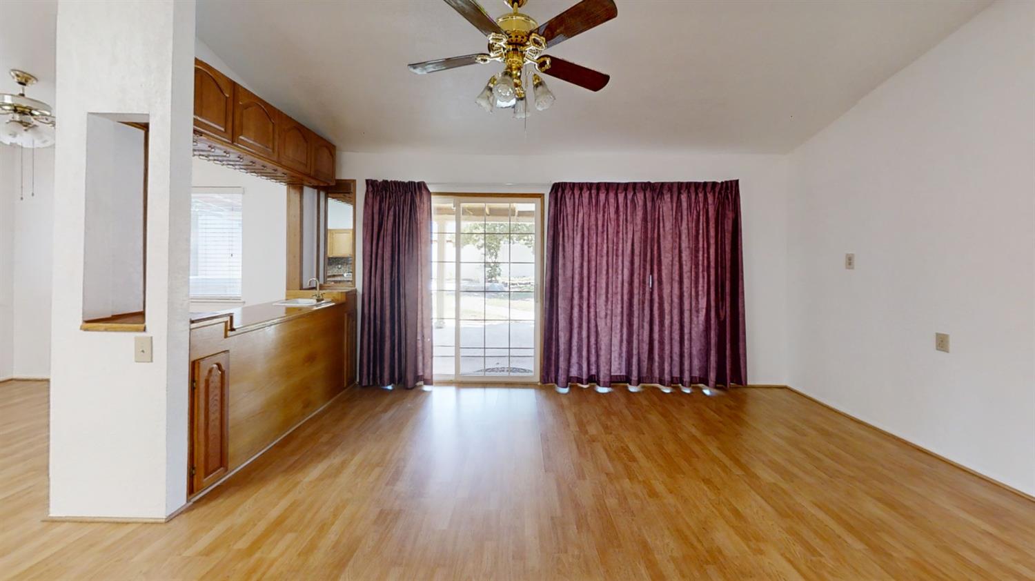 1712 Poppy Meadow Court Coalinga, CA 93210 - Photo 10 of 30 wooden floor in an empty room with a window