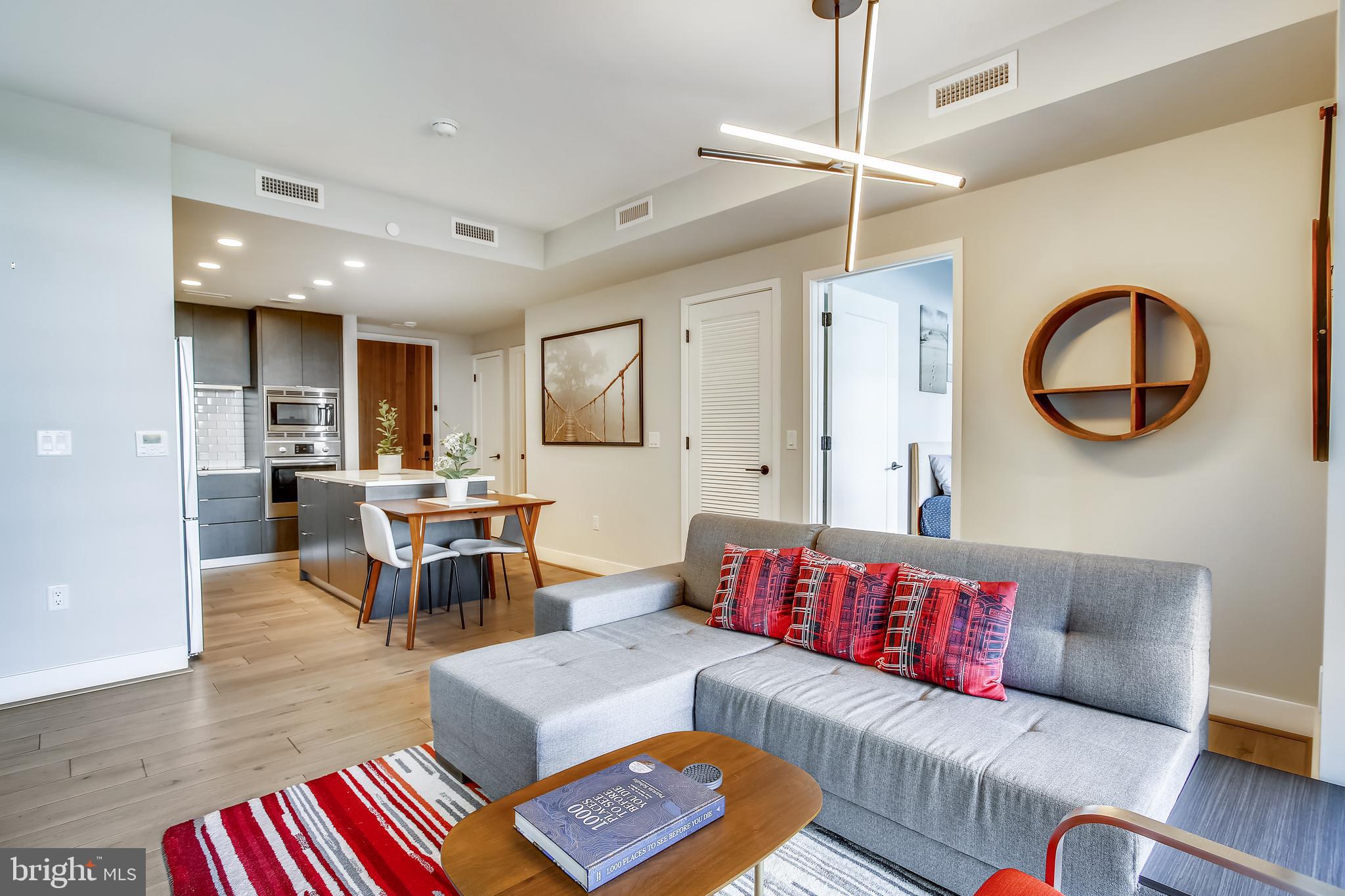 1300 4th Street Southeast, Unit 408 Washington, DC 20003 - Photo 13 of 57 Living looking to Kitchen and Second Bedroom