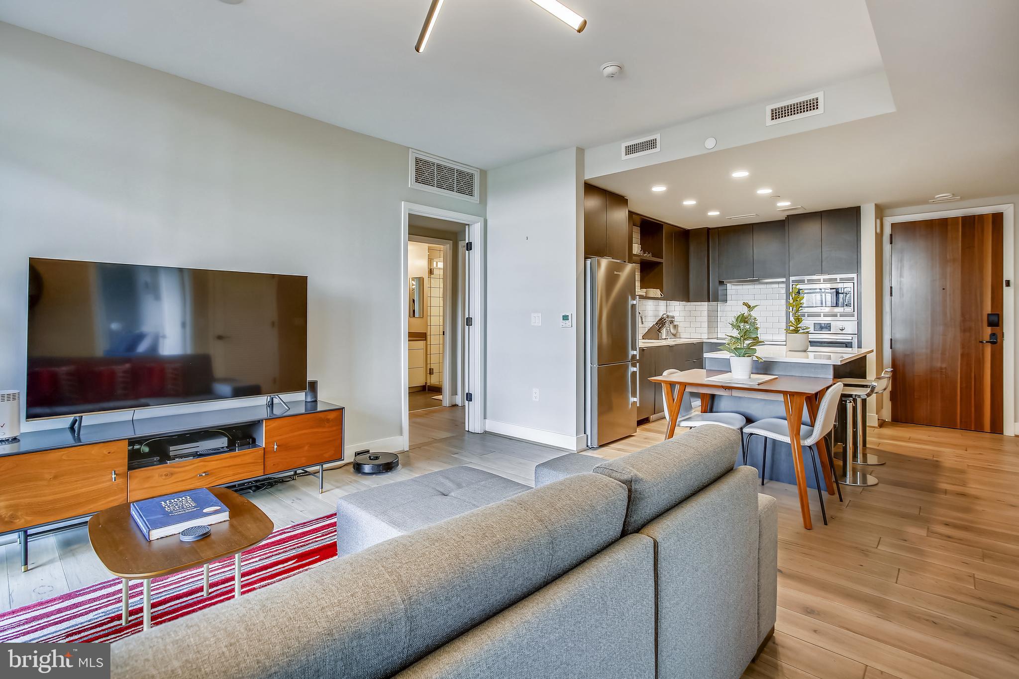 1300 4th Street Southeast, Unit 408 Washington, DC 20003 - Photo 14 of 57 Living looking to Kitchen and Primary Bedroom
