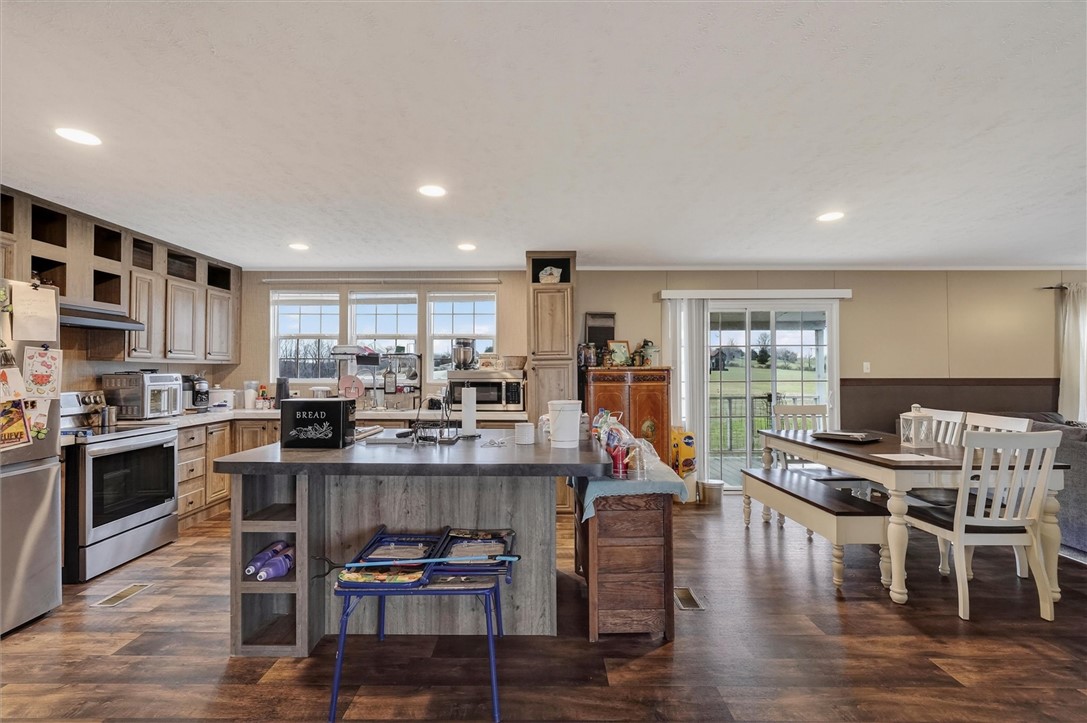 1926 Fairview Road Peebles, OH 45660 - Photo 31 of 44 This spacious kitchen offers a large island, modern appliances, and seamless access to outdoor views.