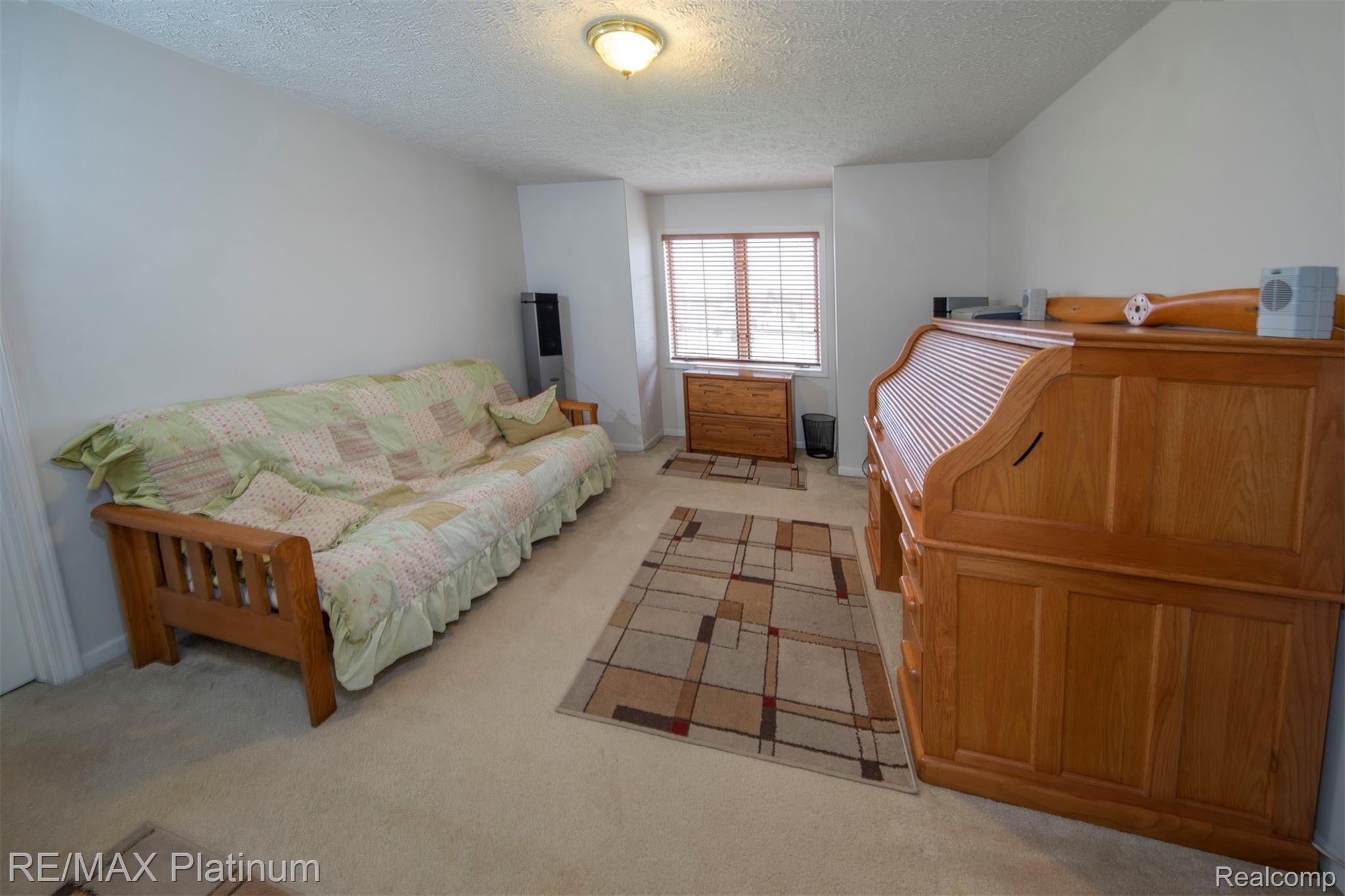 2500 Ridgewood Drive Howell, MI 48843 - Photo 19 of 31 2nd upstairs bedroom also with a walk in closet