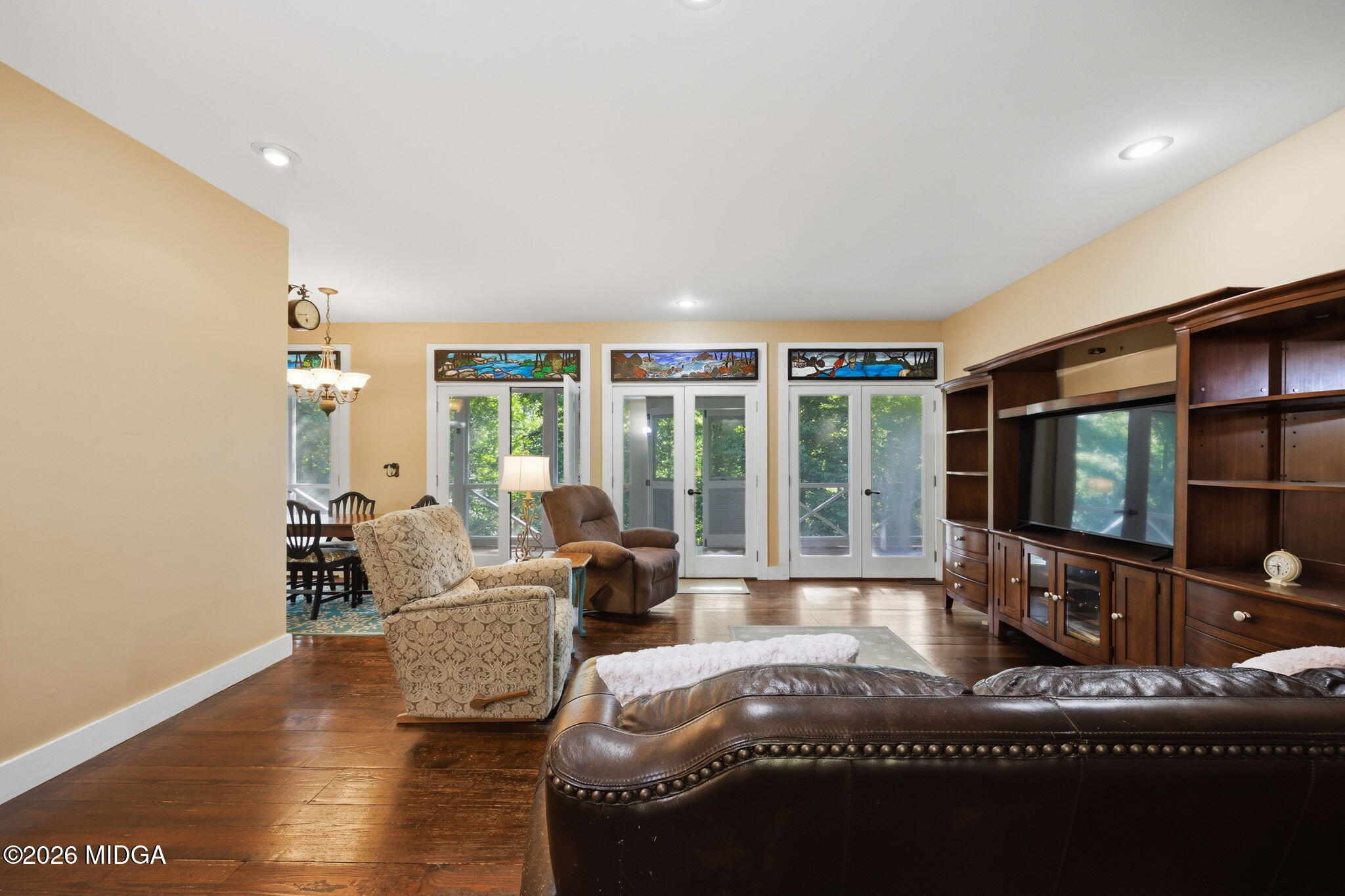4686 Johnstonville Road Forsyth, GA 31029 - Photo 7 of 34 a living room with furniture window and a flat screen tv