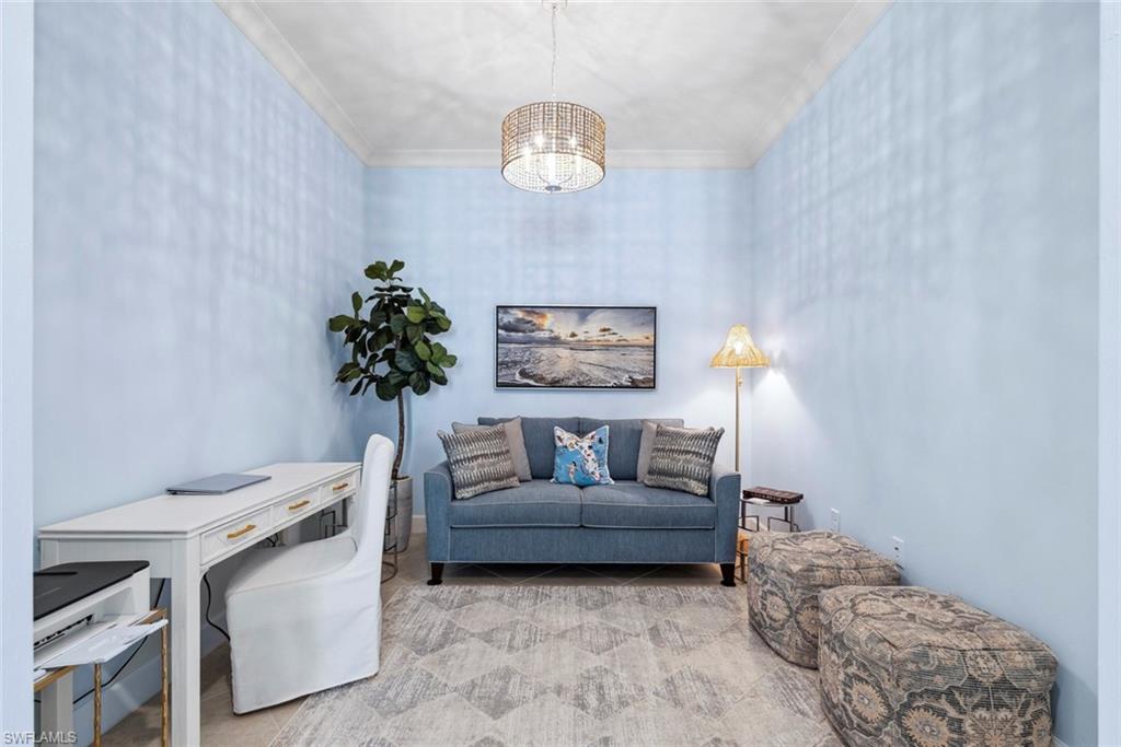 5690 Elbow Avenue Naples, FL 34113 - Photo 17 of 39 a living room with furniture and a chandelier