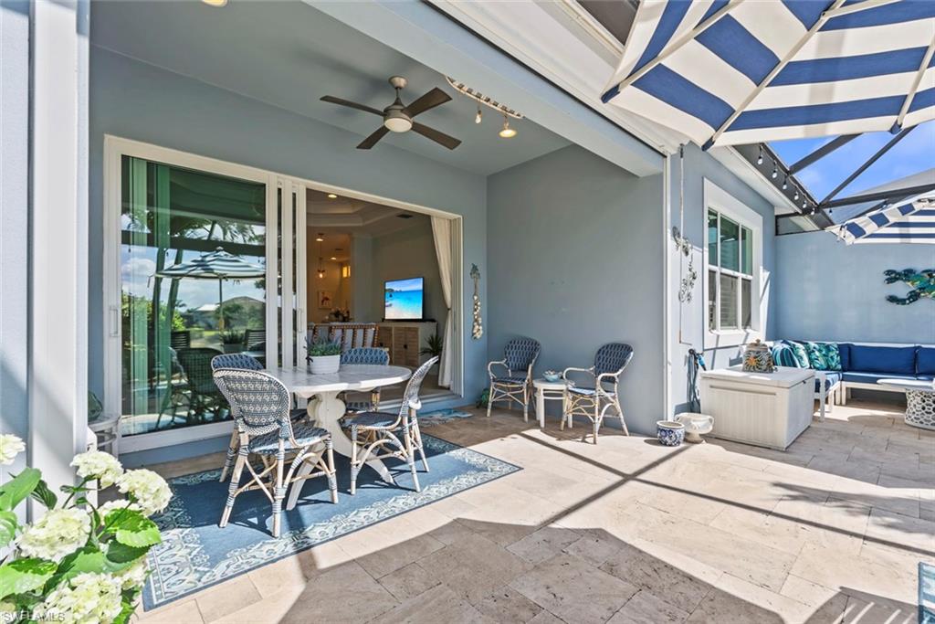 5690 Elbow Avenue Naples, FL 34113 - Photo 20 of 39 a dining room with a table and chairs