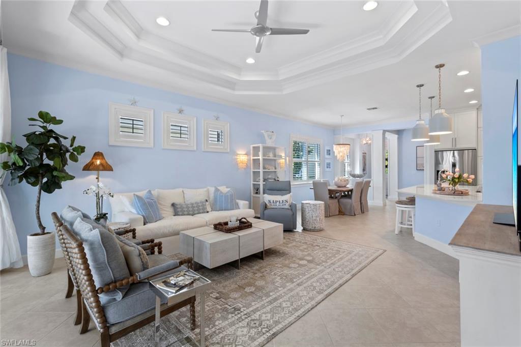 5690 Elbow Avenue Naples, FL 34113 - Photo 2 of 39 a living room with furniture and a potted plant