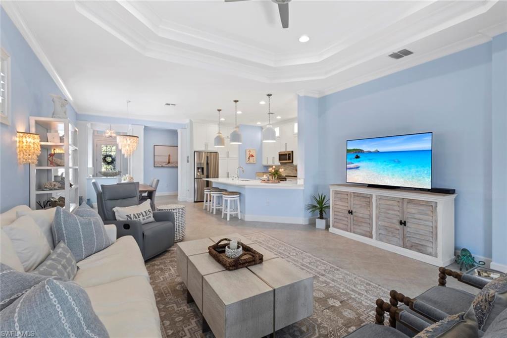 5690 Elbow Avenue Naples, FL 34113 - Photo 3 of 39 a living room with furniture and a flat screen tv