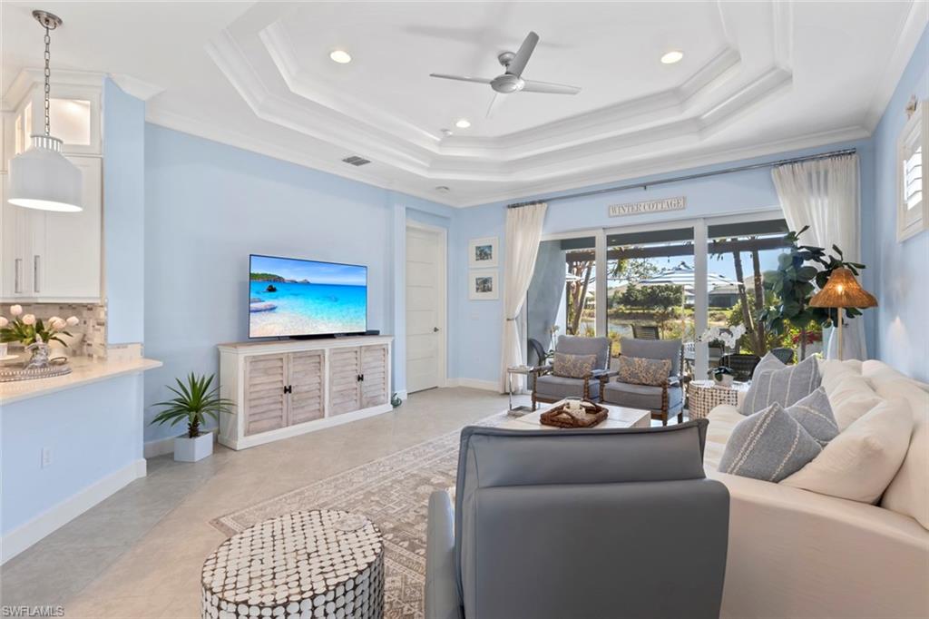 5690 Elbow Avenue Naples, FL 34113 - Photo 4 of 39 a living room with furniture and a flat screen tv