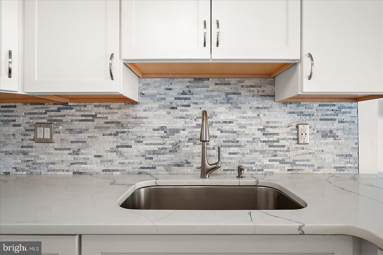 18 69th Street, Unit 9 Ocean City, MD 21842 - Photo 17 of 60 a close view of sink and tap