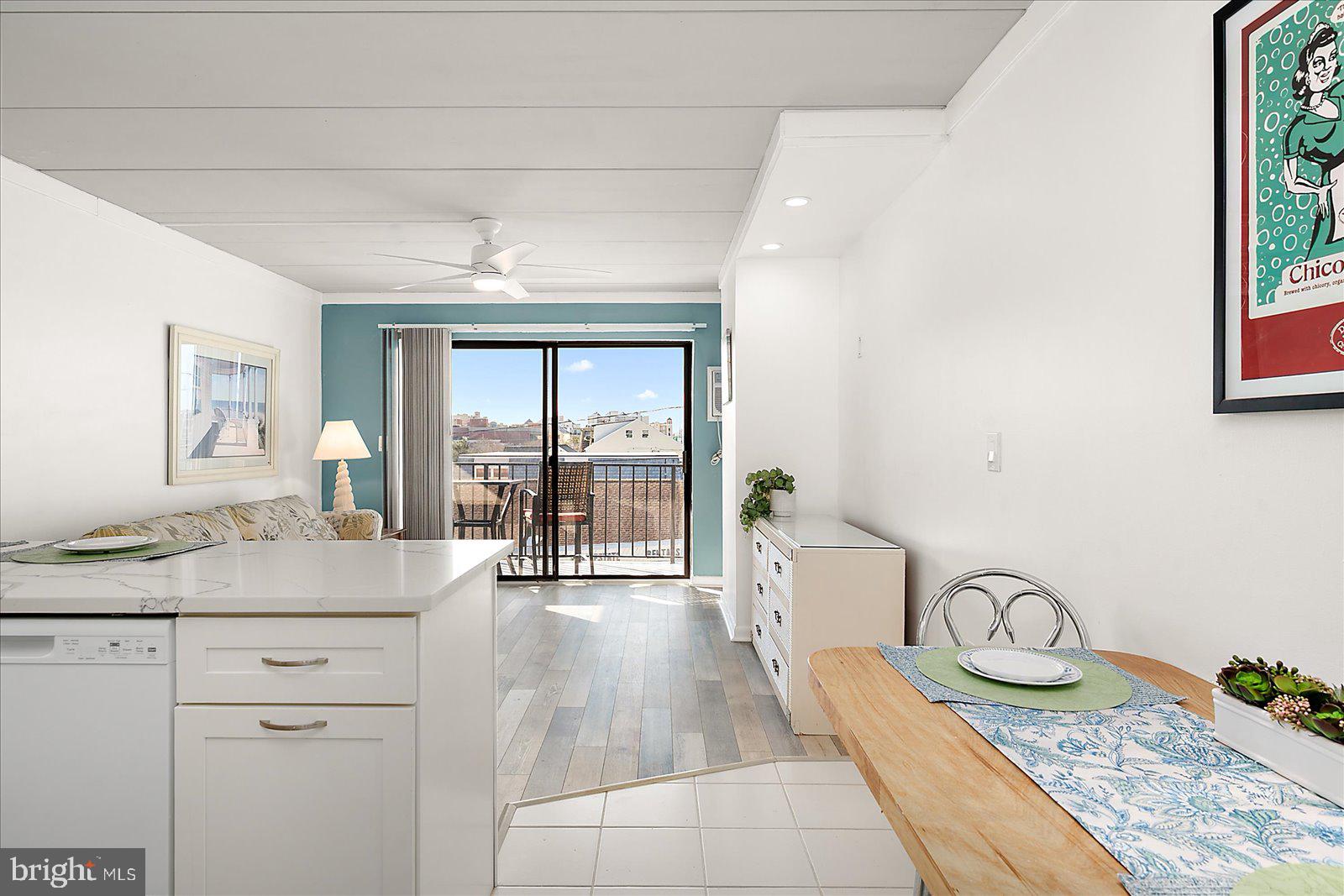 18 69th Street, Unit 9 Ocean City, MD 21842 - Photo 18 of 60 a spacious bathroom with a granite countertop sink a mirror and shower