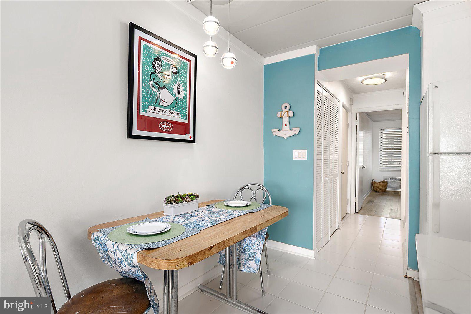 18 69th Street, Unit 9 Ocean City, MD 21842 - Photo 19 of 60 a view of a dining room with furniture