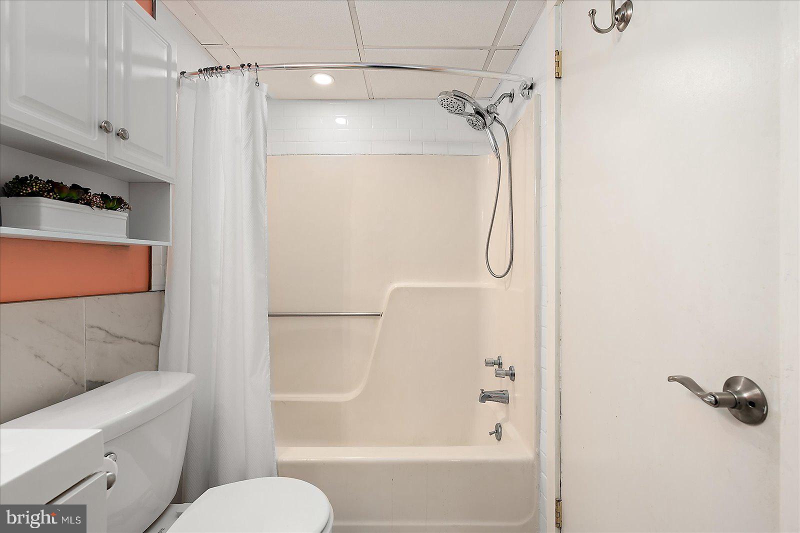 18 69th Street, Unit 9 Ocean City, MD 21842 - Photo 29 of 60 a bathroom with a shower a toilet and a shower