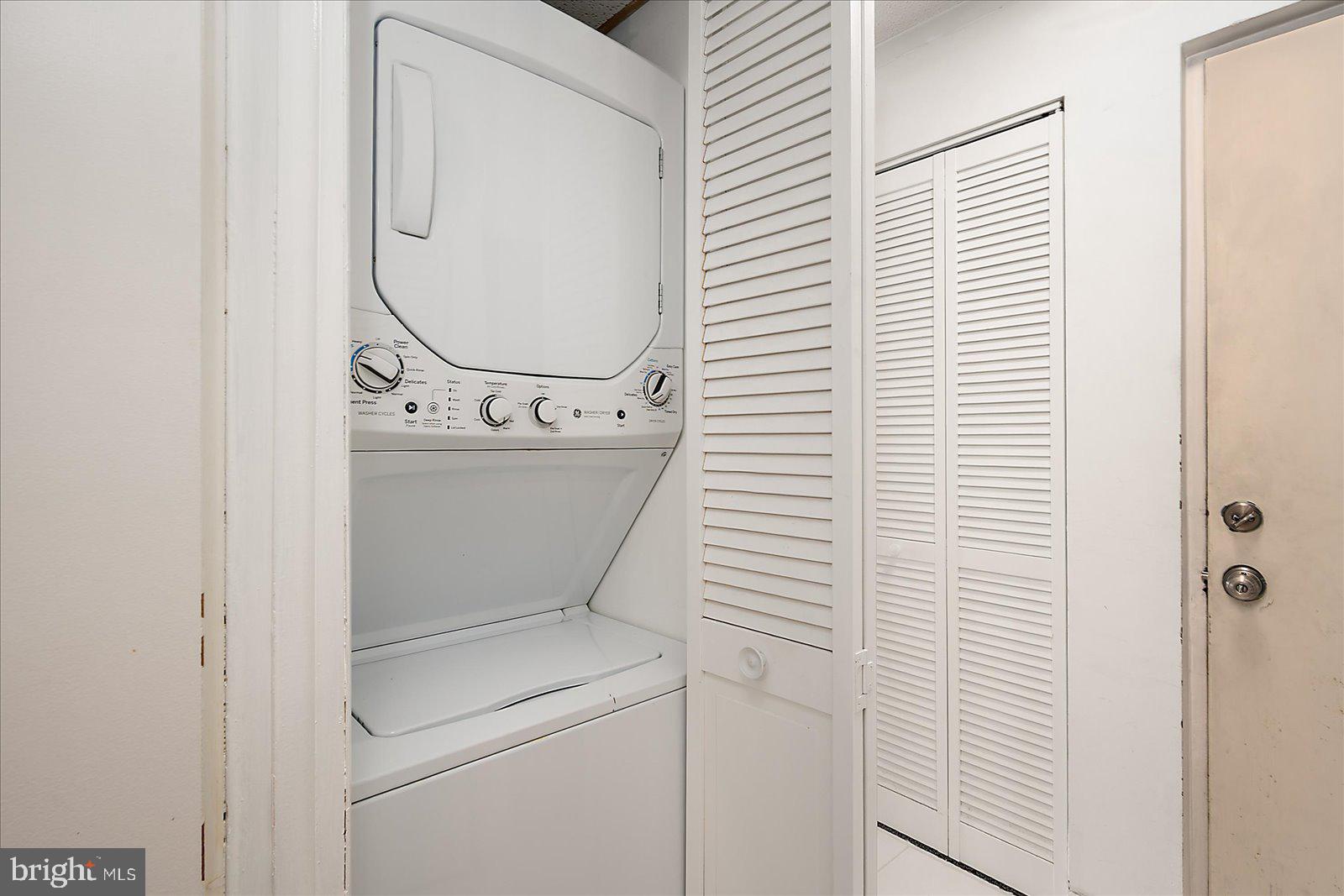 18 69th Street, Unit 9 Ocean City, MD 21842 - Photo 31 of 60 a utility room with dryer and washer