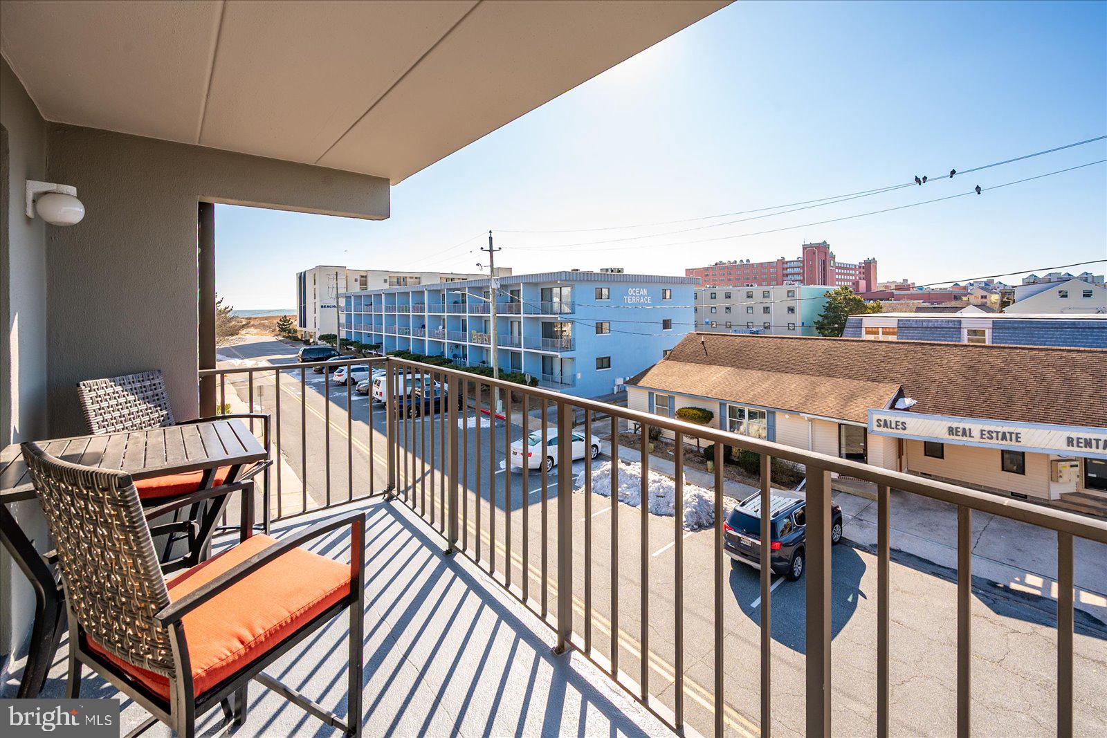 18 69th Street, Unit 9 Ocean City, MD 21842 - Photo 33 of 60 a balcony with an outdoor seating