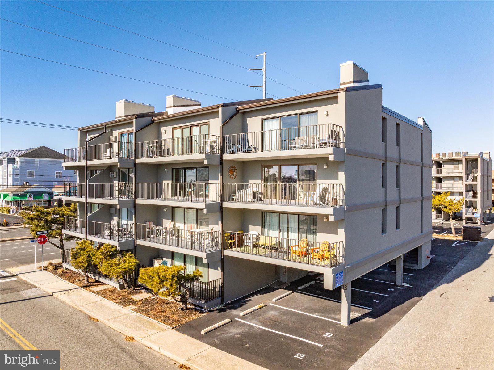 18 69th Street, Unit 9 Ocean City, MD 21842 - Photo 38 of 60 a front view of a building with glass windows
